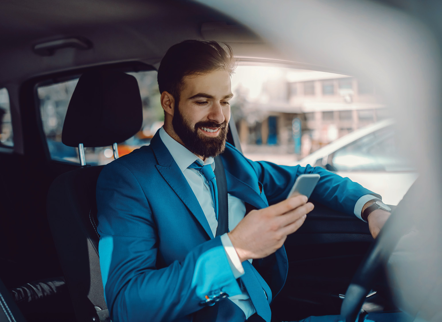 Business traveler driving his rental car