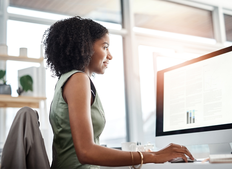 Smiling employee working at computer